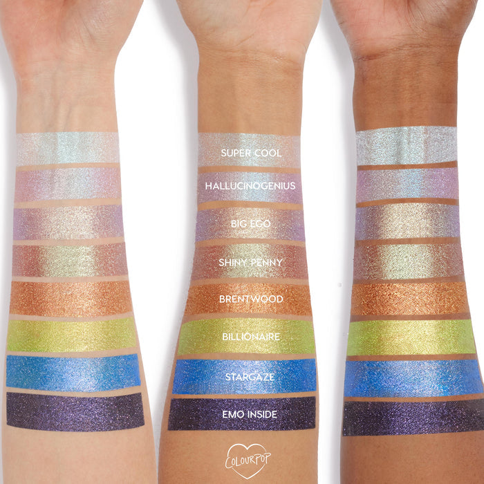 Big Ego Jelly Much Shadow swatch gleams lavender‑violet with iridescent sparkle on three arms, displayed alongside other labeled shades to compare pigment and shine in the ColourPop Jelly Much Shadow collection.