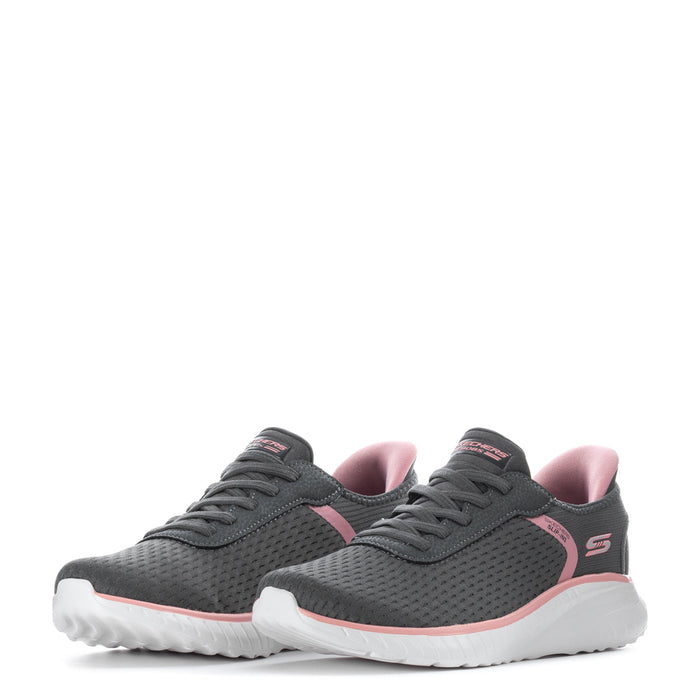 Pair of Womens grey slip-in sneakers with pink lining and white cushioned soles