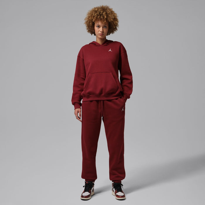 Women’s fleece pullover hoodie in team red with kangaroo pocket and Jordan logo