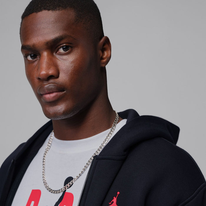 Men's black zip-up hoody hood with red logo and white crew neck visible; close-up.
