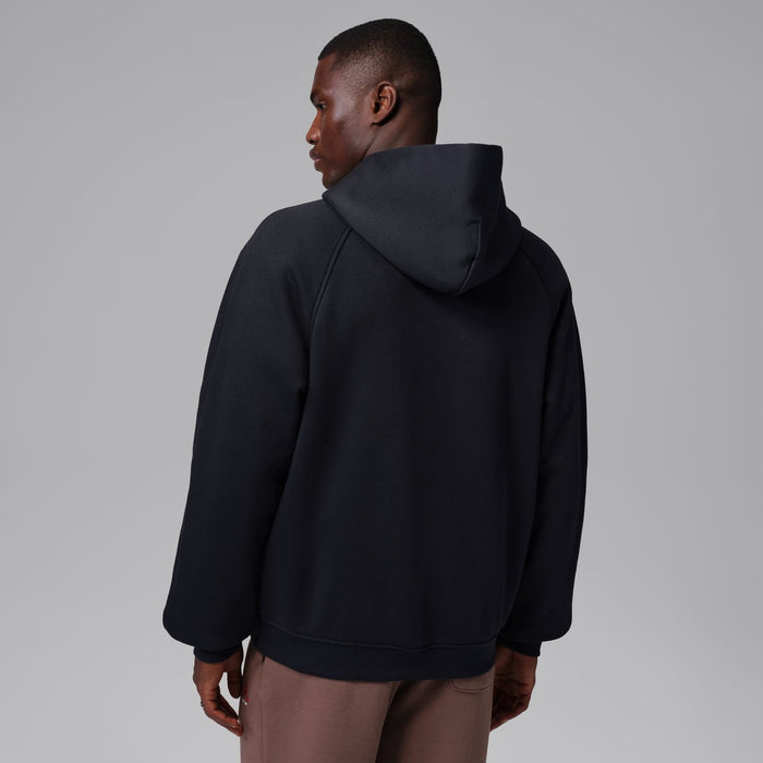 Black zip-up hoody with hood from back view on model.