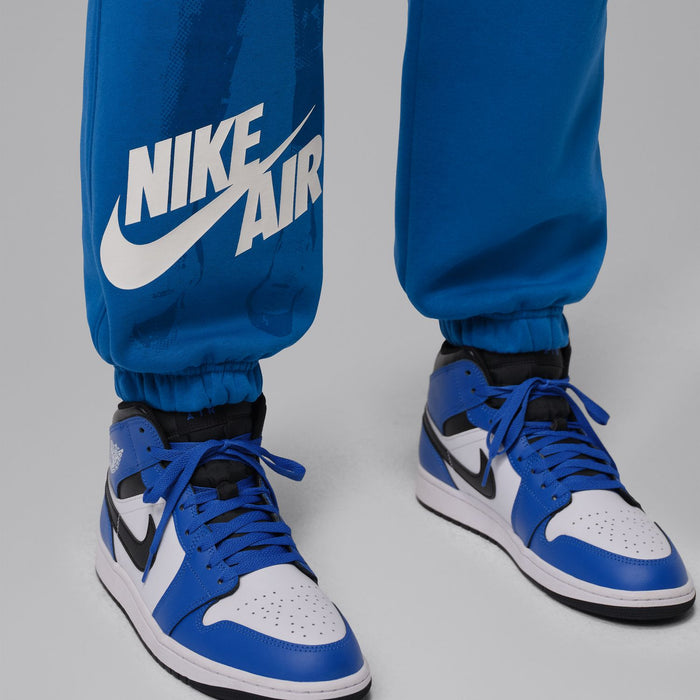 Men's blue cuff jogger pants with Nike Air logo on leg and gathered ankle cuffs