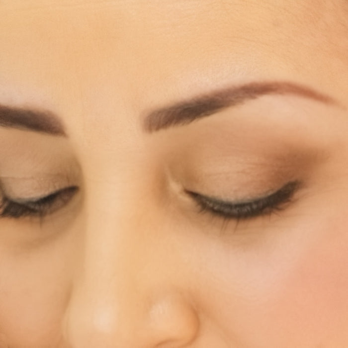 Close up of woman's eyes wearing Demure Eye Colors Pink Copper, Gold Shimmer & Brown Liner