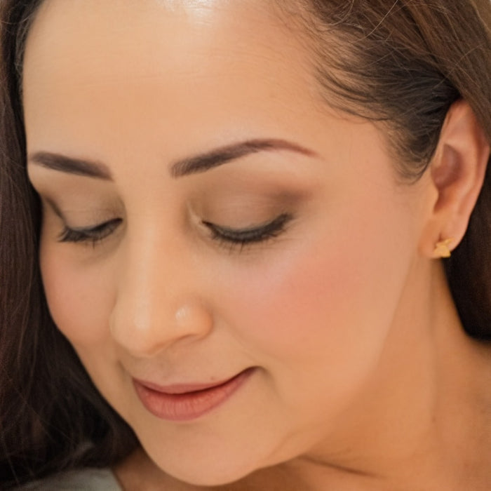 Woman wearing Demure Eye Colors Pink Copper, Gold Shimmer & Brown Liner