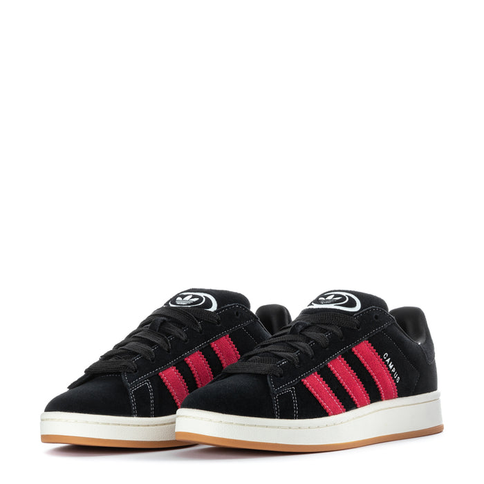 Pair of men's black sneakers with red three stripes, laces, and logo on tongues