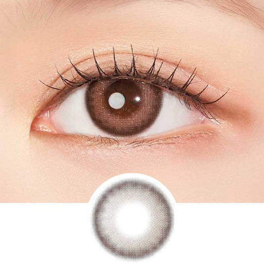 A close-up of an eye wearing Clalen IRIS Pink Tulip (10pk) lenses by Clalen shows a natural, slightly enlarging effect. Below is an image of the lens displaying its pink color and pattern, suitable for myopia prescription.