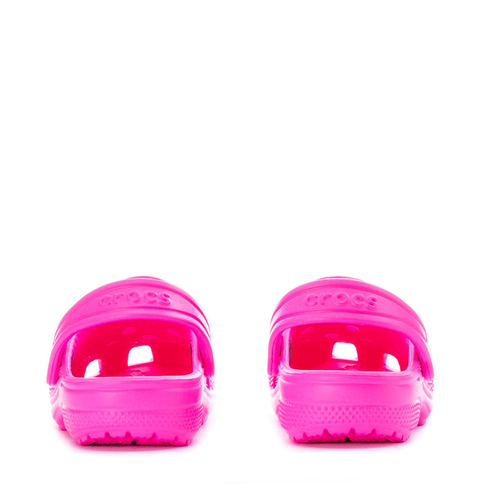 Bright pink toddler clogs, rear view with vented back and textured outsole.
