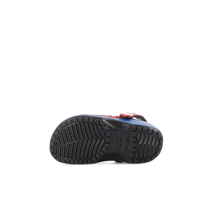 Toddler clog outsole view with dark tread and blue edge trim