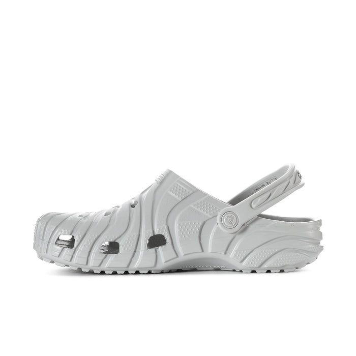 Men's white clog with perforated upper, heel strap, and chunky outdoor sole