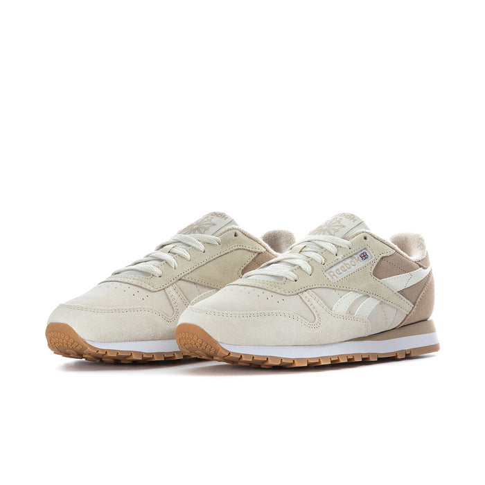 Women's cream sneakers with tan overlays, lace-up design, gum rubber sole