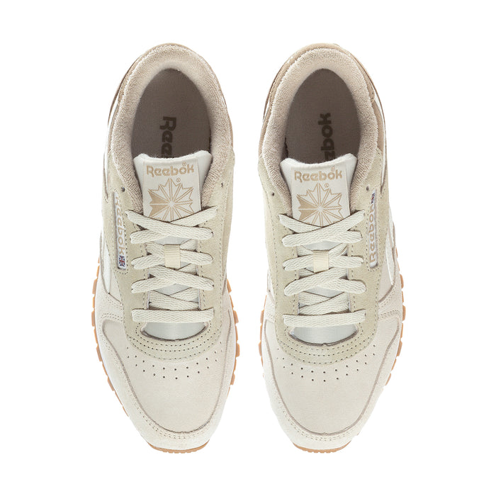Women's cream lace-up sneakers with Reebok logo on tongue and perforated toe