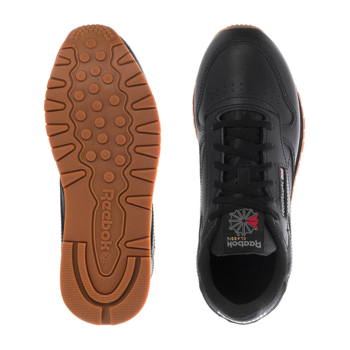 Black sneaker outsole and heel: gum tread with Reebok heel pull tab