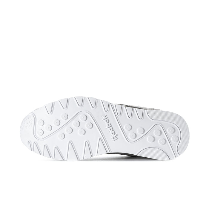 Men's Reebok sneaker outsole, white tread with circular grip pads