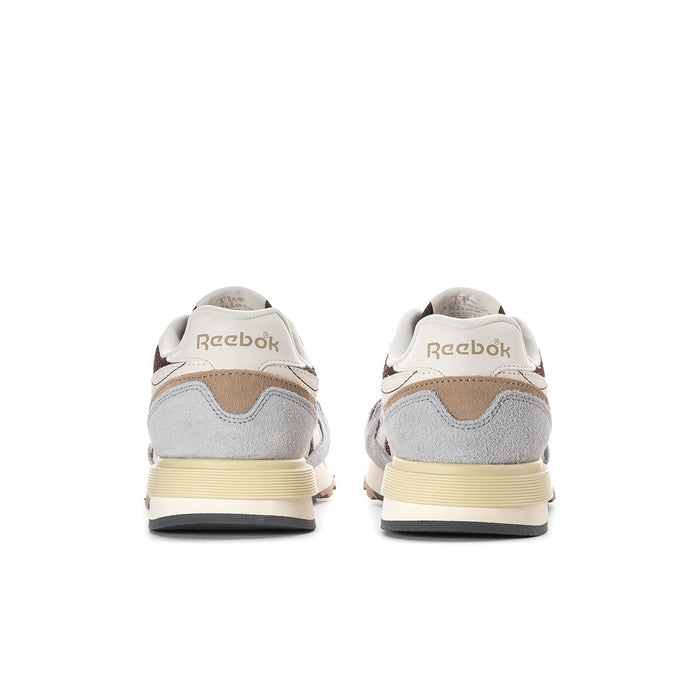 Women's Reebok sneakers back view with brown heel details and cream sole