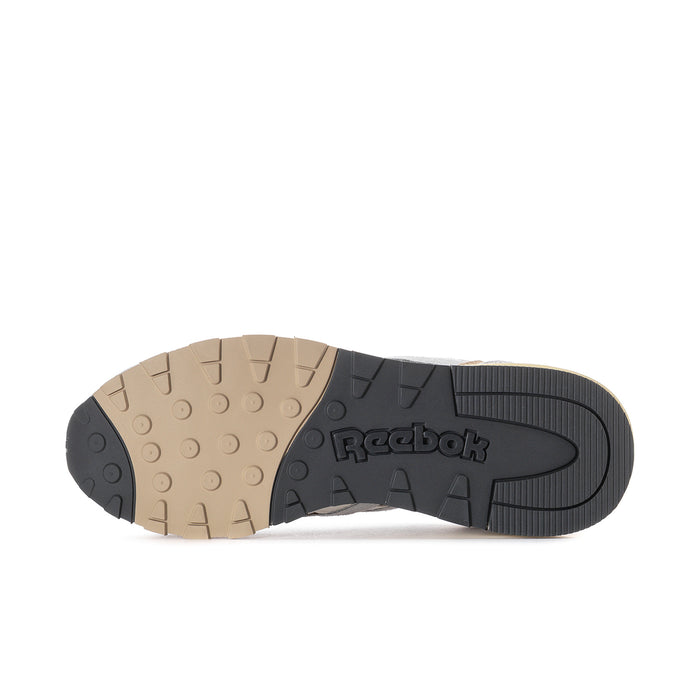 Women's Reebok sneaker outsole tread with dark and tan rubber