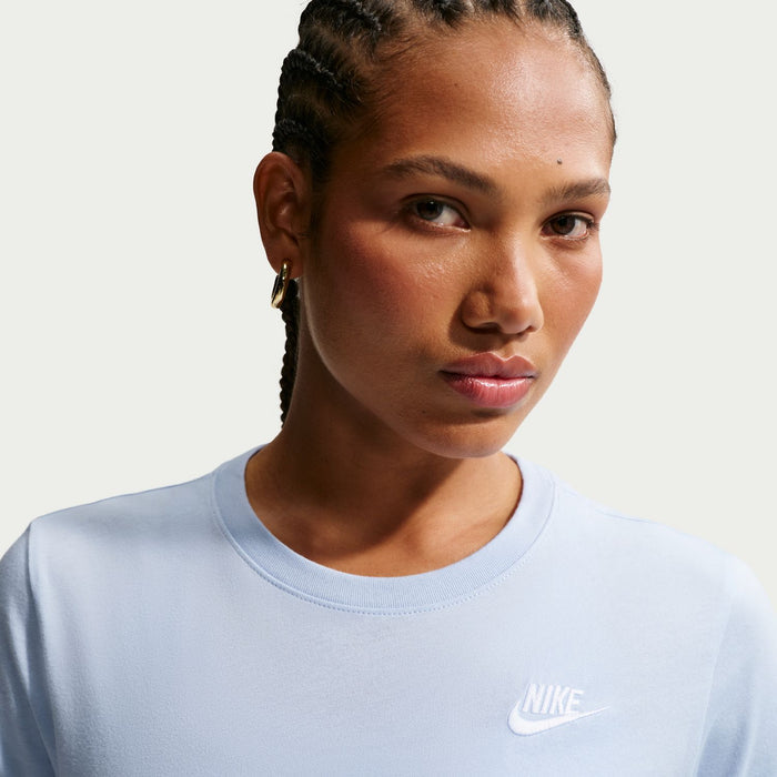 Women’s light blue Nike crew-neck tee with small chest logo, close-up view