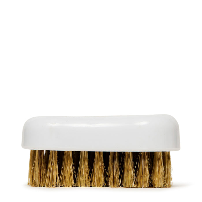 Soft bristle shoe brush with tan bristles and white plastic handle base