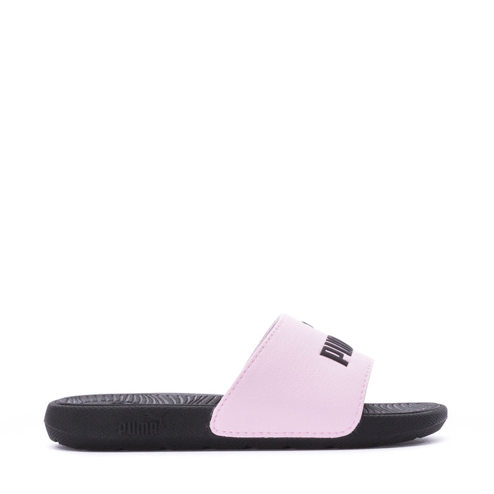 Kids pink slide sandals with black sole and PUMA logo on the strap
