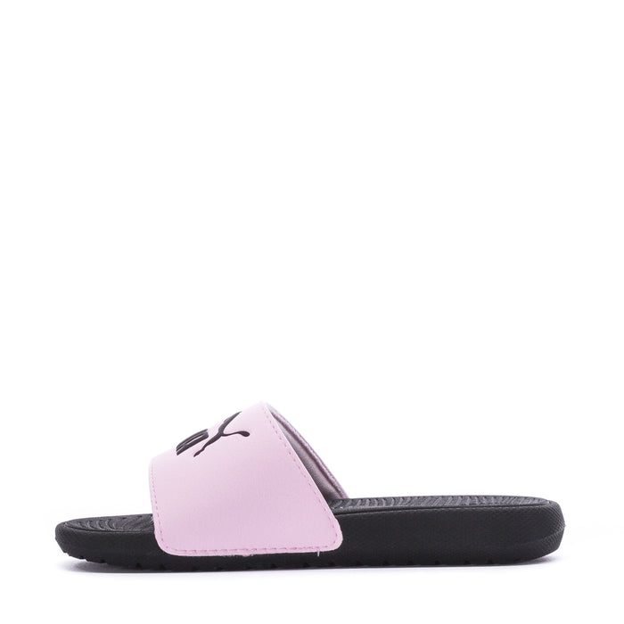 Kids pink slide sandals viewed from side; black outsole and PUMA logo