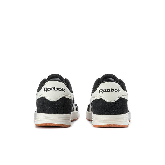Men's Reebok Court Advance sneakers rear view, black with white heel panels and gum sole