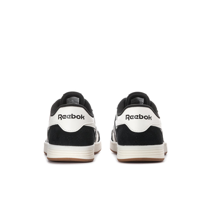 Men's Reebok sneakers back view, black heel with white heel tab and gum sole