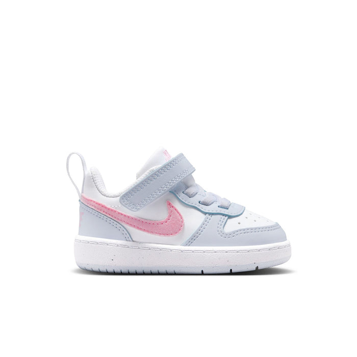 Kids low-top sneakers with pink Nike swoosh, light blue heel tab, Velcro strap