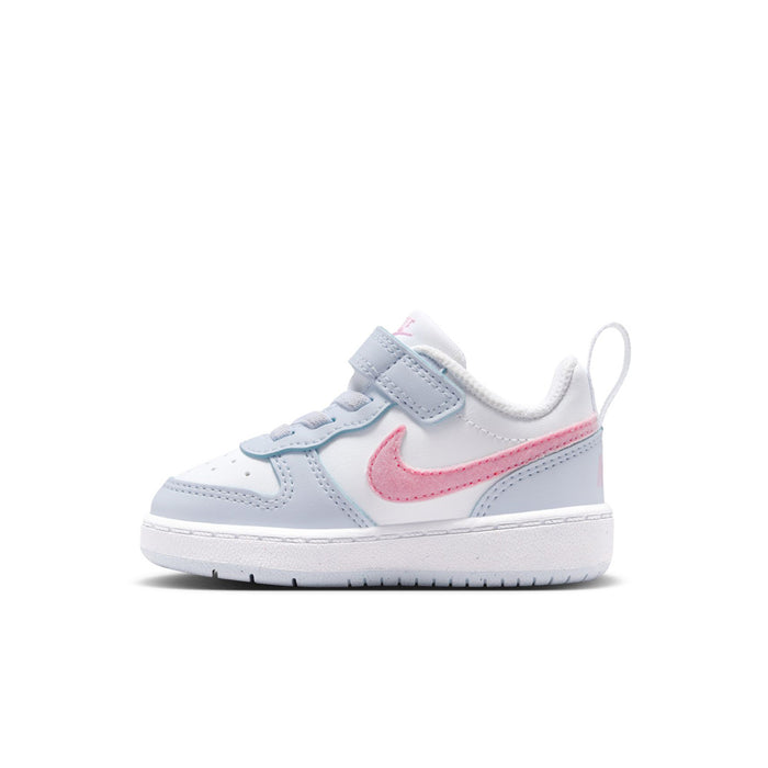 Toddler low-top sneakers with white upper, pink swoosh, light blue hook-and-loop strap