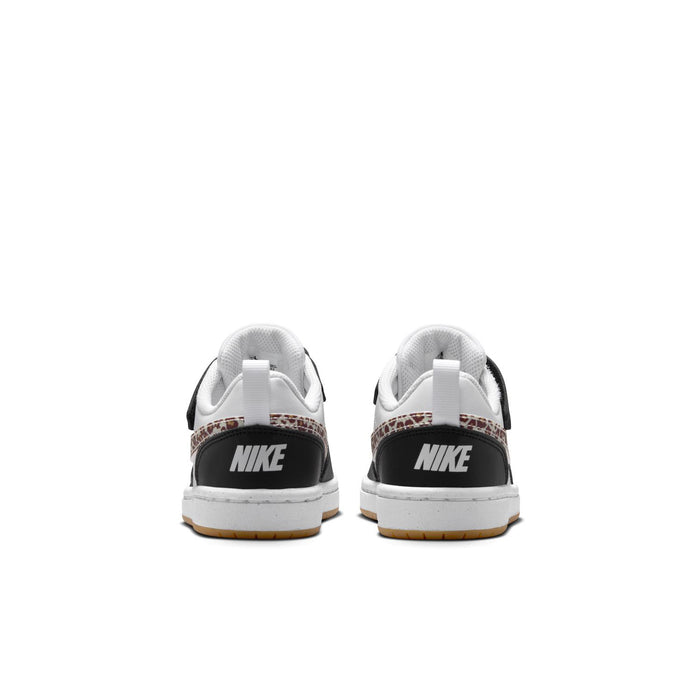 Kids low-top sneakers heel view with NIKE logo on black back and tan gum outsole