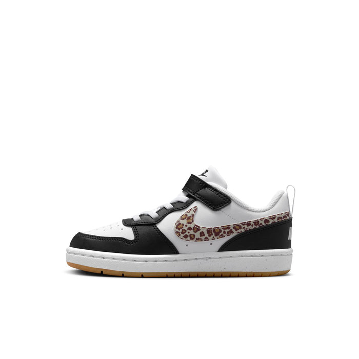 Kids low-top sneakers side view in white and black with leopard swoosh and strap