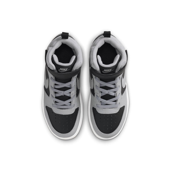Kids sneakers showing black and light gray uppers with lace eyelets and Nike heel label.