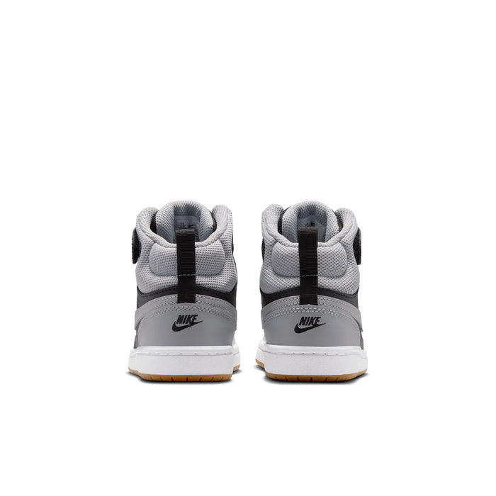 Kids mid-top sneakers from heel view with black heel strap, light gray lining, gum sole.