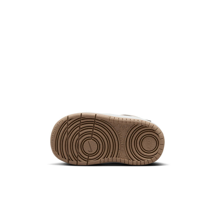 Toddler sneaker outsole in brown with circular traction pattern