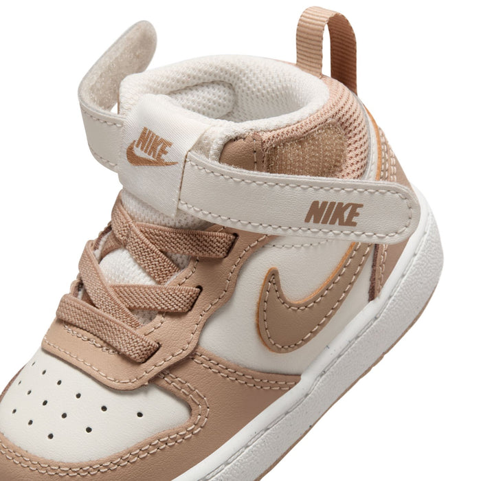 Toddler sneaker close-up of ankle collar, Nike heel logo, padded white lining
