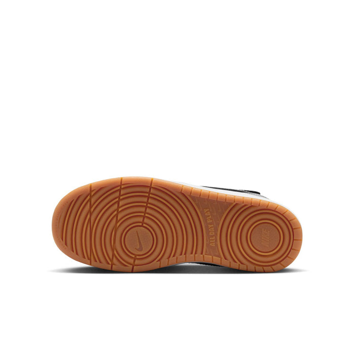 Youth sneaker outsole with gum rubber tread and circular traction design.
