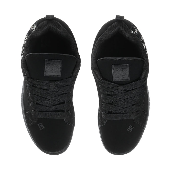 Black low-top sneakers with lace-up front and cushioned heel with label patch.