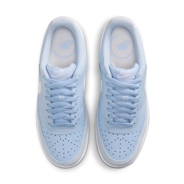 Light blue lace-up sneakers with perforated toe and padded collar.