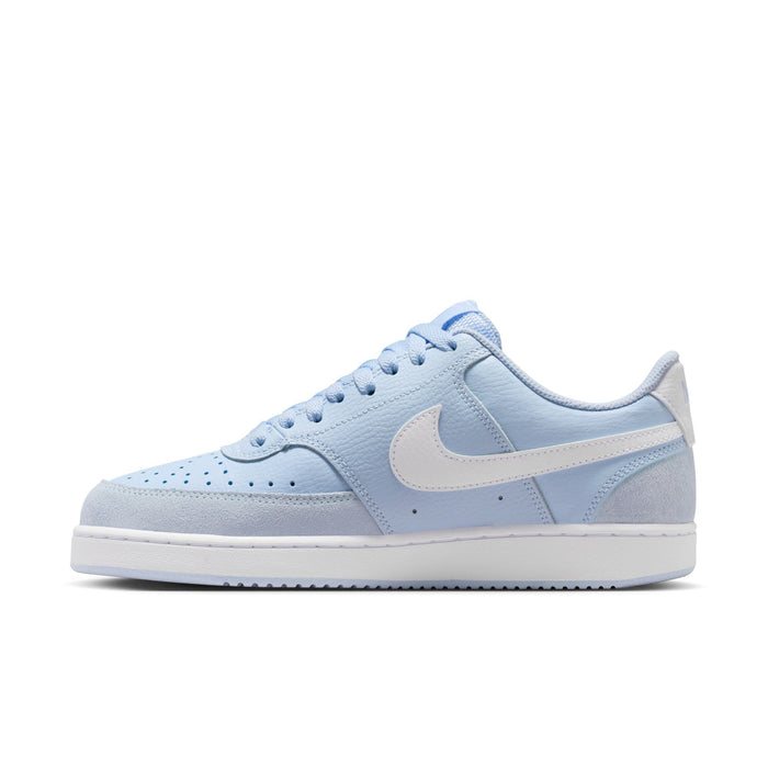 Light blue low-top sneakers in suede with white Swoosh and lace-up closure.
