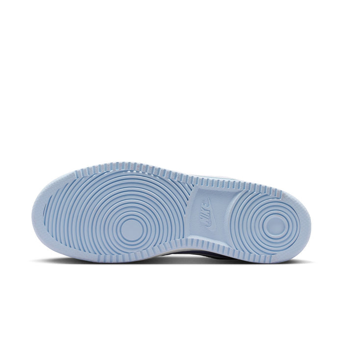 Light blue rubber outsole for low-top sneakers with circular traction pattern.