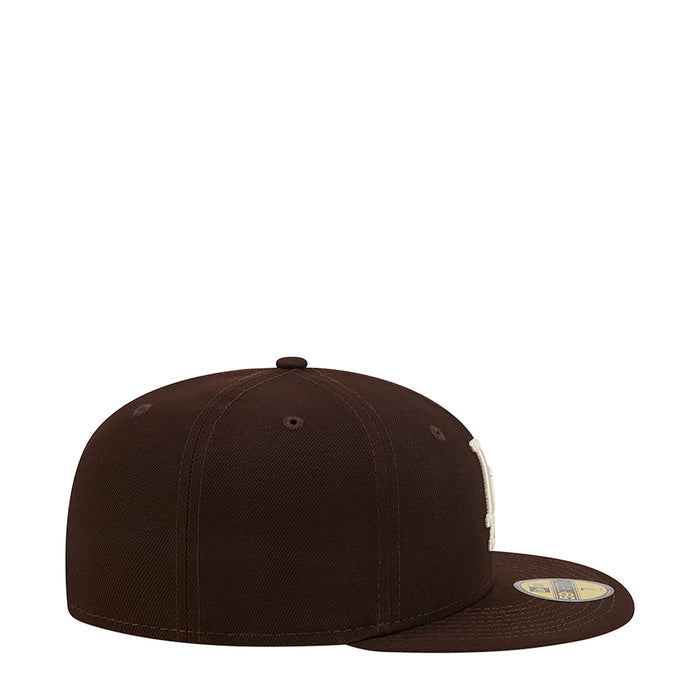 Brown baseball cap with side patch near flat brim
