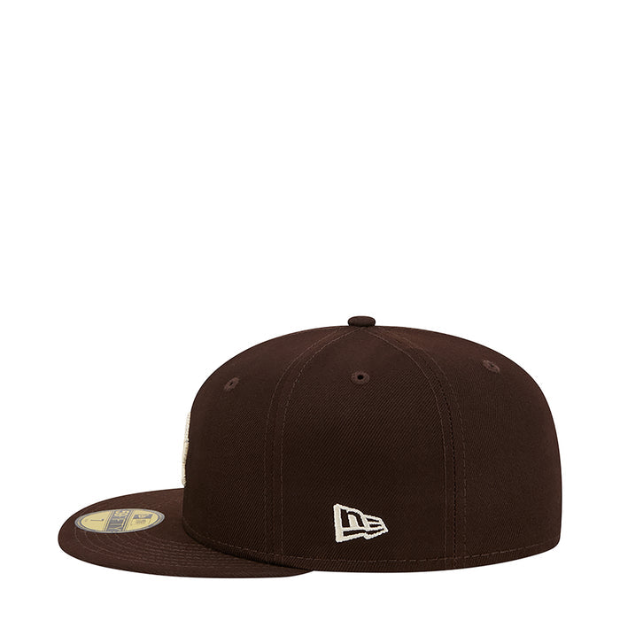 Brown baseball cap with white New Era flag logo on front