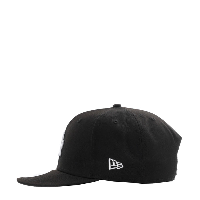 Black baseball cap with small white New Era logo on side