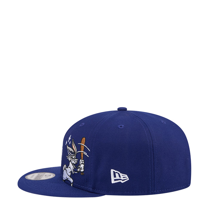 Navy snapback cap with Bugs Bunny graphic and New Era logo on side.