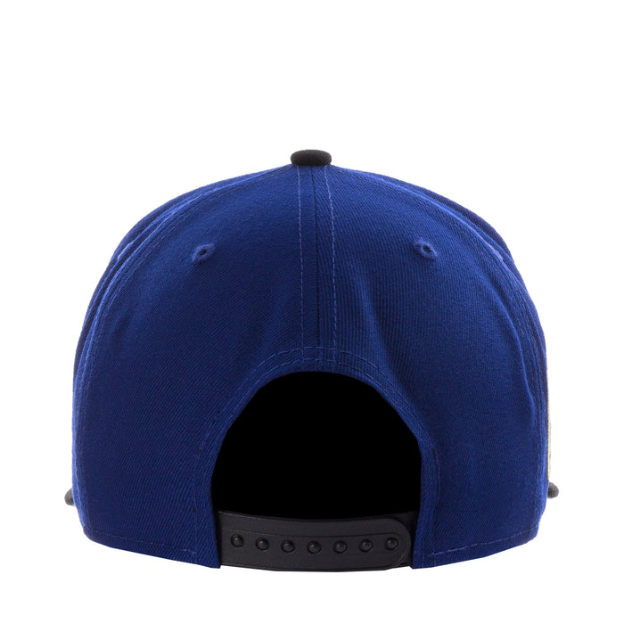 Royal blue baseball cap back view with black snapback strap and eyelets