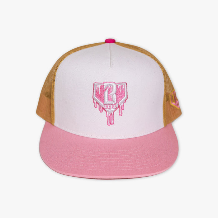 Adult model wearing white and pink Drip Mesh Off Field Snapback snapback