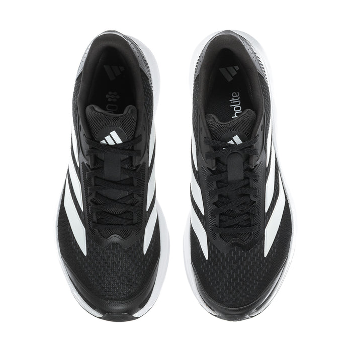 Black men's running sneakers shown from toe with white sole and lace-up front