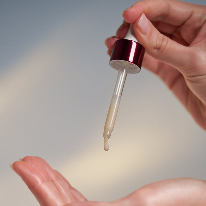 dynamic skin strengthening serum being dispensed