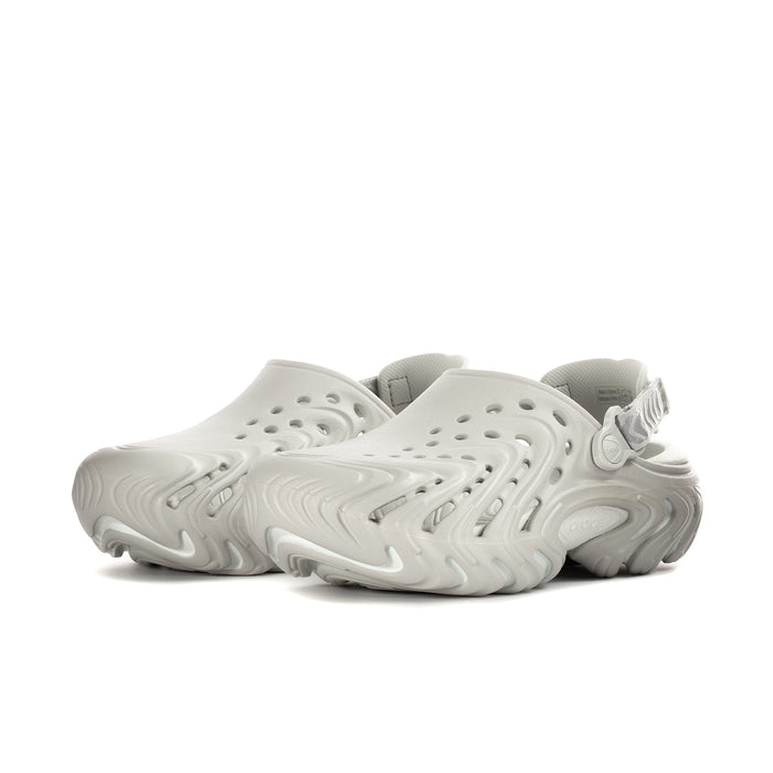 Mens white slip-on clog with perforated upper and adjustable heel strap, side view