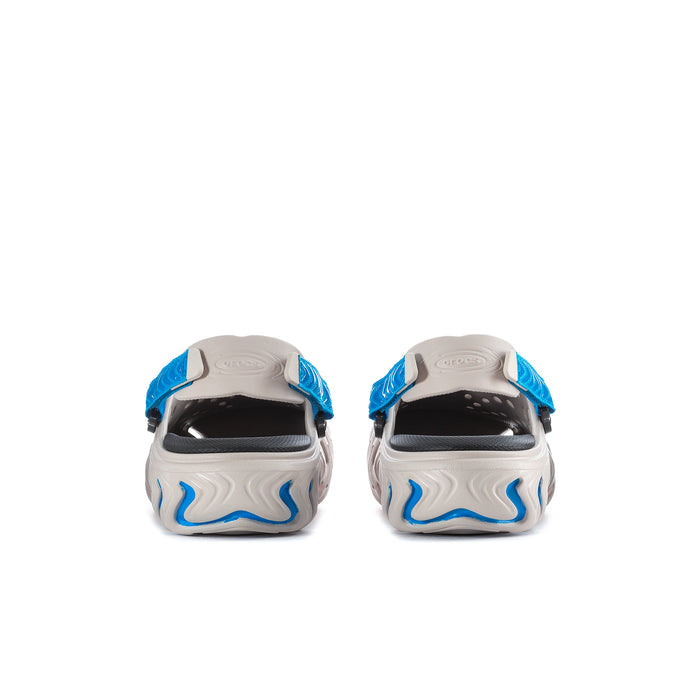 Men's clogs rear view with blue wavy outsole and black heel counters