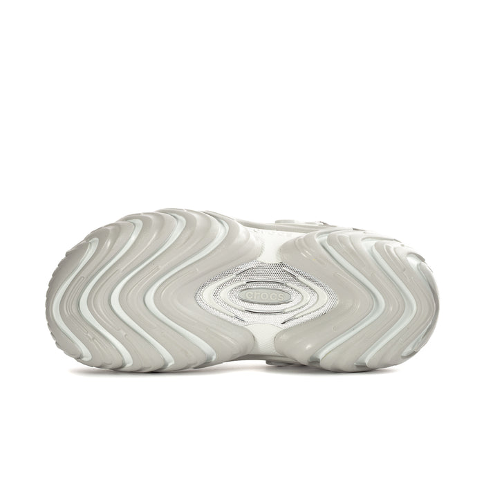 Mens white clog outsole with wavy tread pattern and oval heel logo