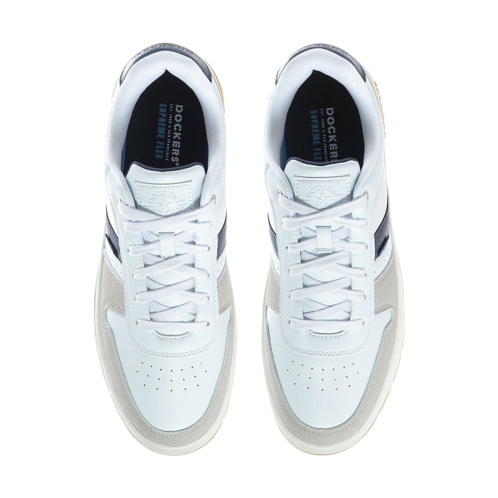 White low-top sneakers with laced uppers; navy heel lining; Dockers logo on tongue.